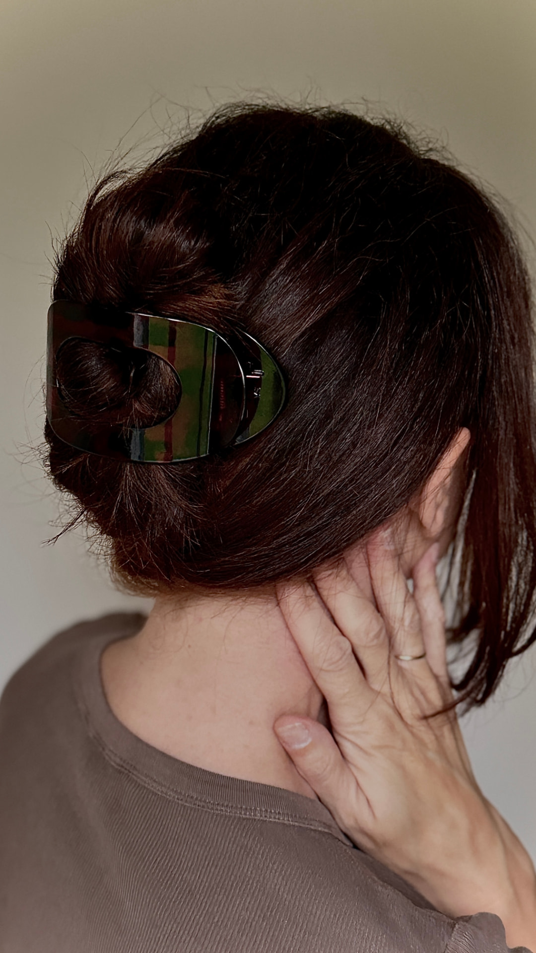Close-up of a tortoiseshell hair claw in dark hair